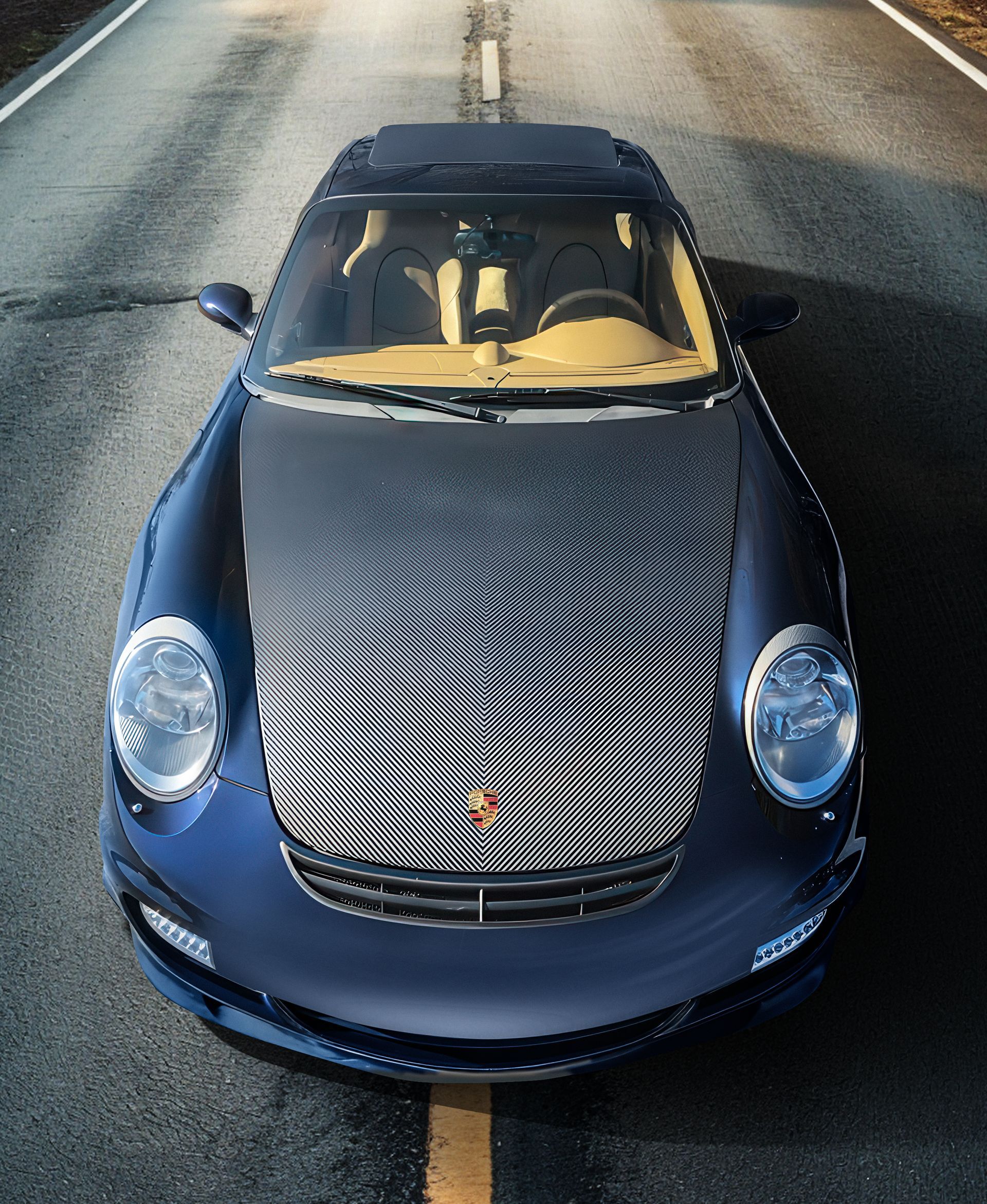 A blue porsche is parked on the side of a road