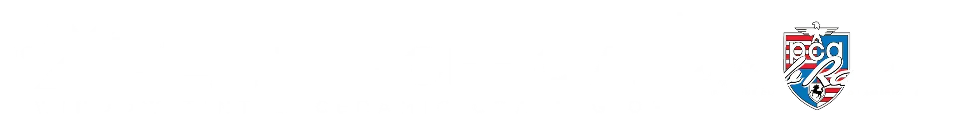 University emblem. A blue and red shield with a crest.