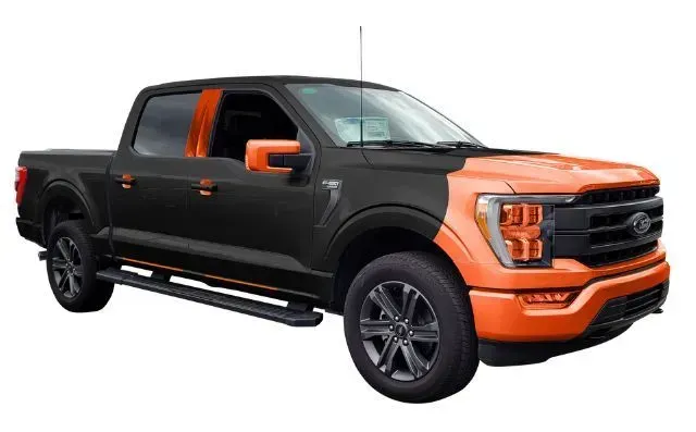 A black and orange ford f150 truck on a white background.