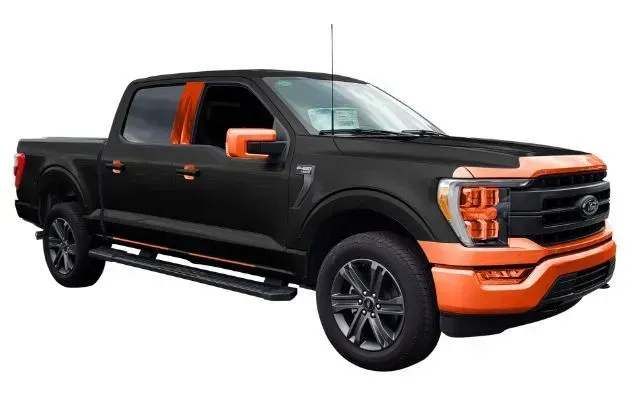 A black and orange ford f150 truck on a white background.