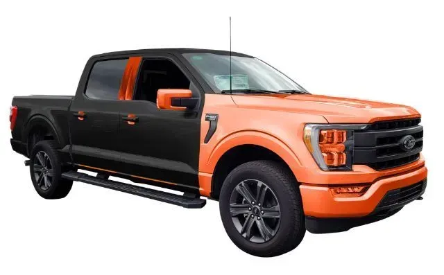 A black and orange pickup truck on a white background.