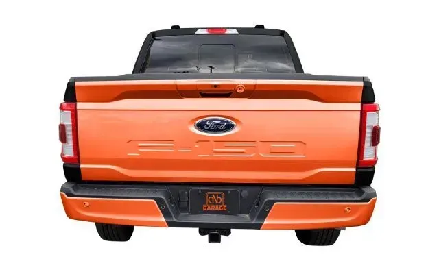 The rear end of a ford f150 truck is shown on a white background.