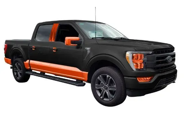 A black and orange ford f150 truck on a white background.