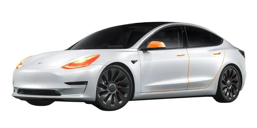 A white tesla model 3 is shown on a white background.