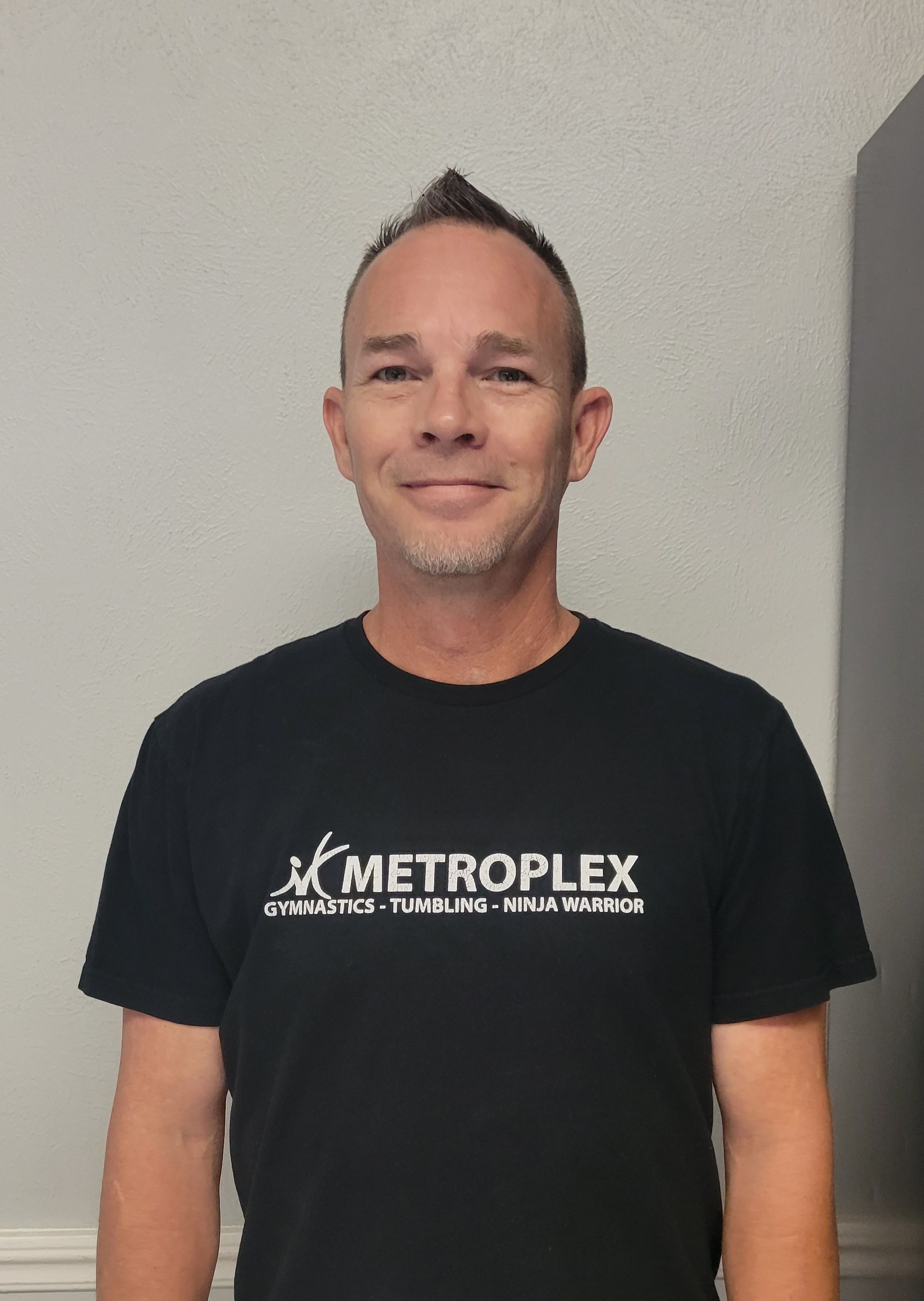 Man wearing a black shirt with the word 