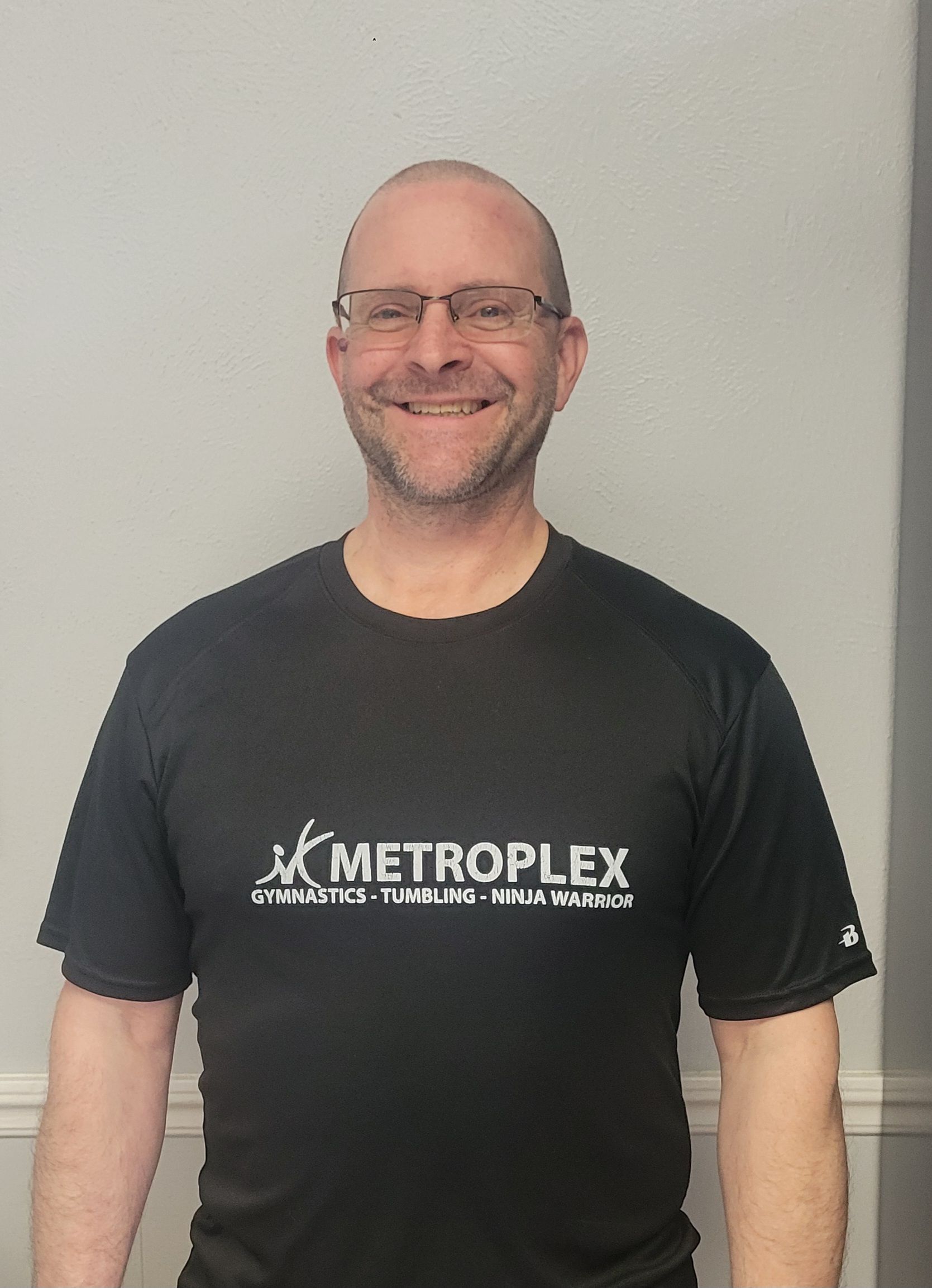 Man wearing glasses, black shirt with 