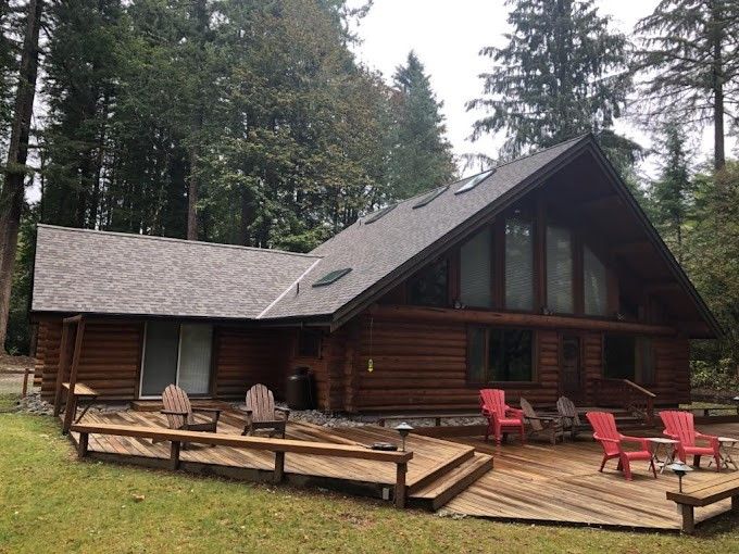 Log cabin with deck.
