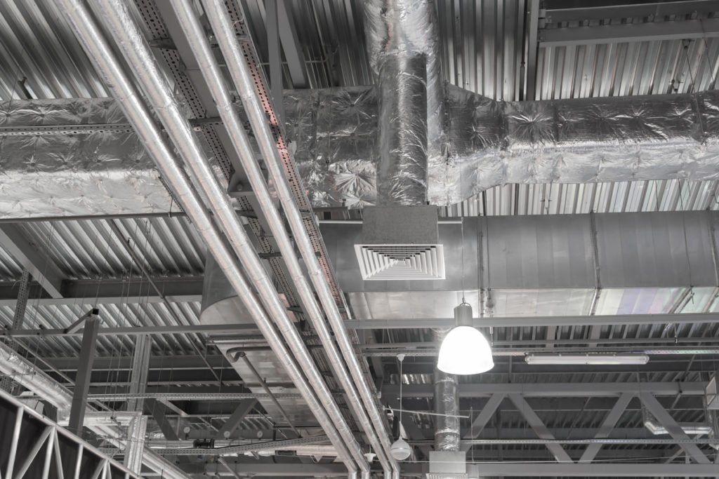 A.C. Manufacturing ducting running along a ceiling
