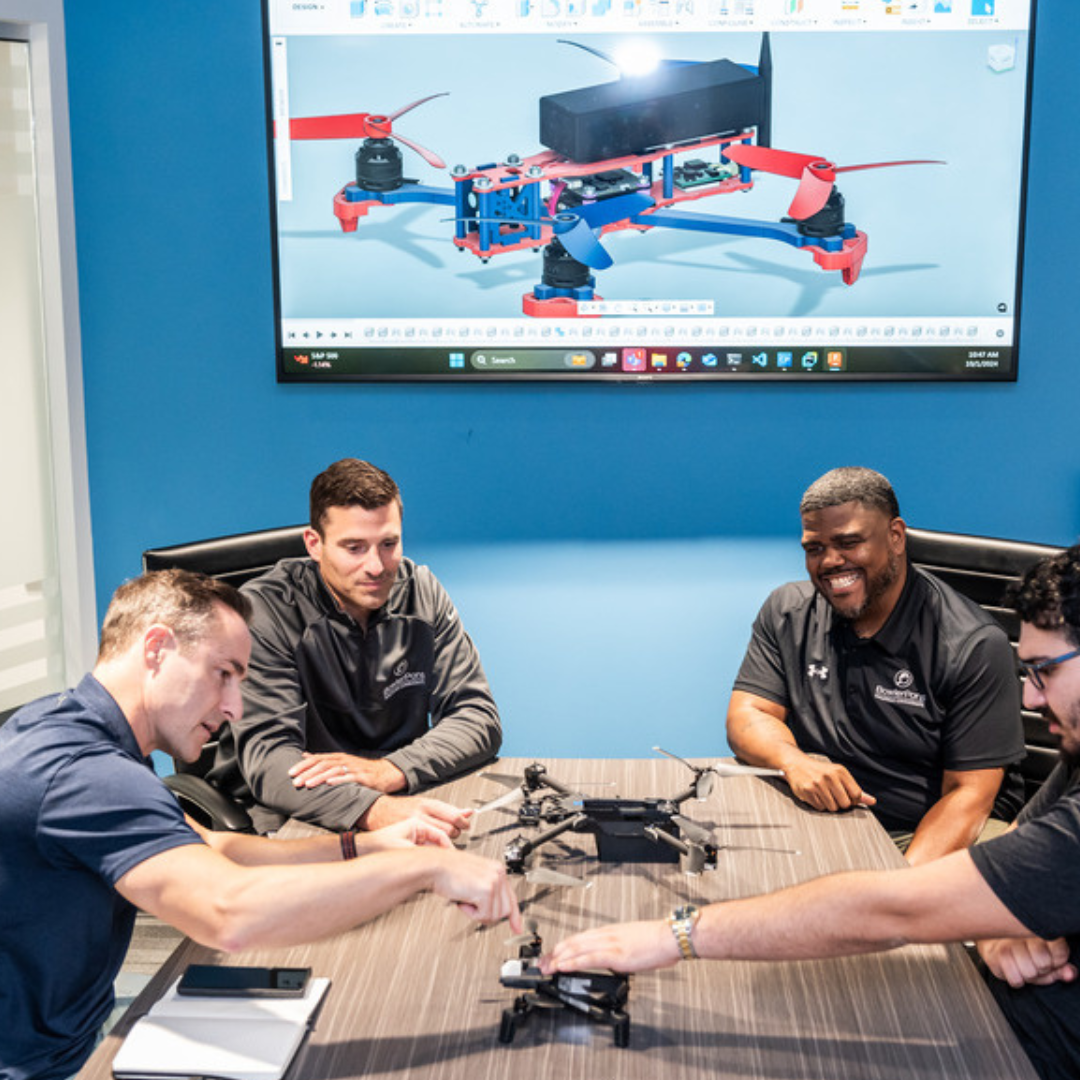 Bowler Pons staff working on a drone in the conference room