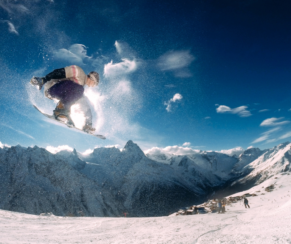 snowboarder pulling off an aerial move on the mountain.