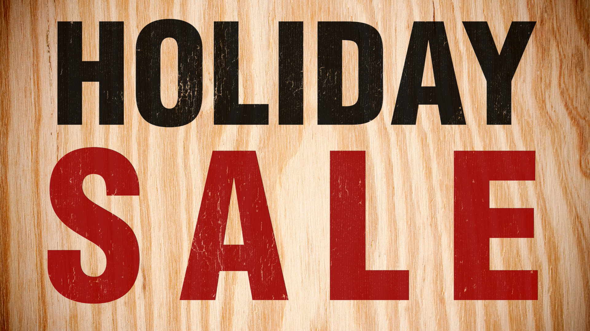 a wooden sign that says holiday sale in black and red