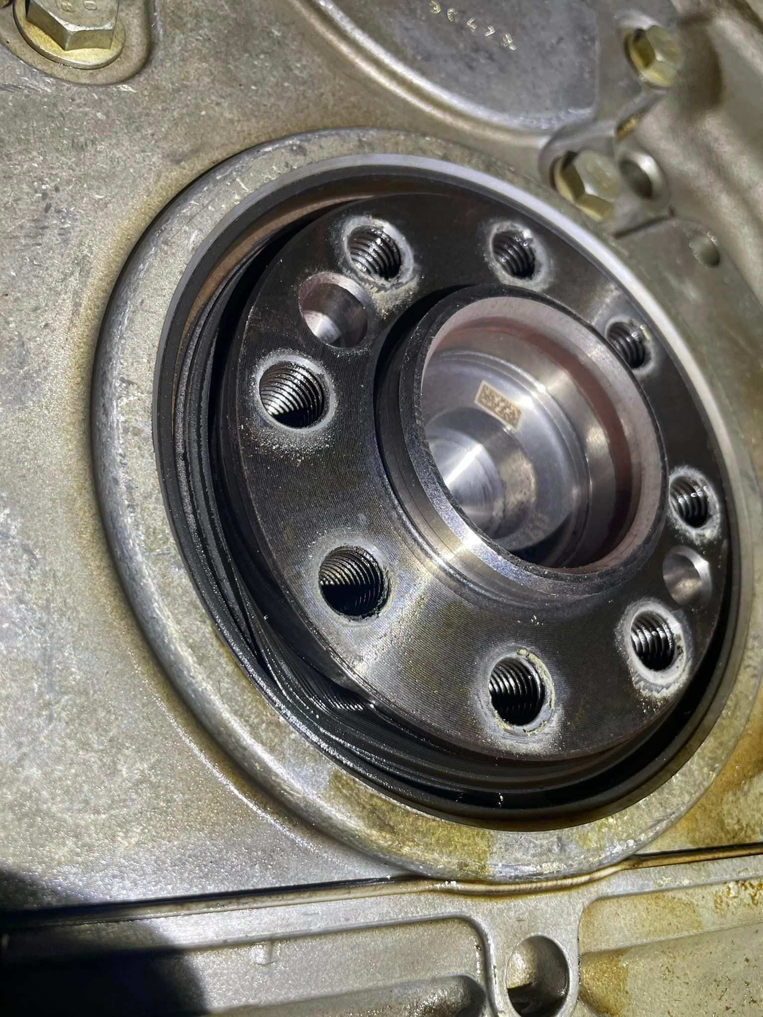 A close up of a metal object with holes in it.