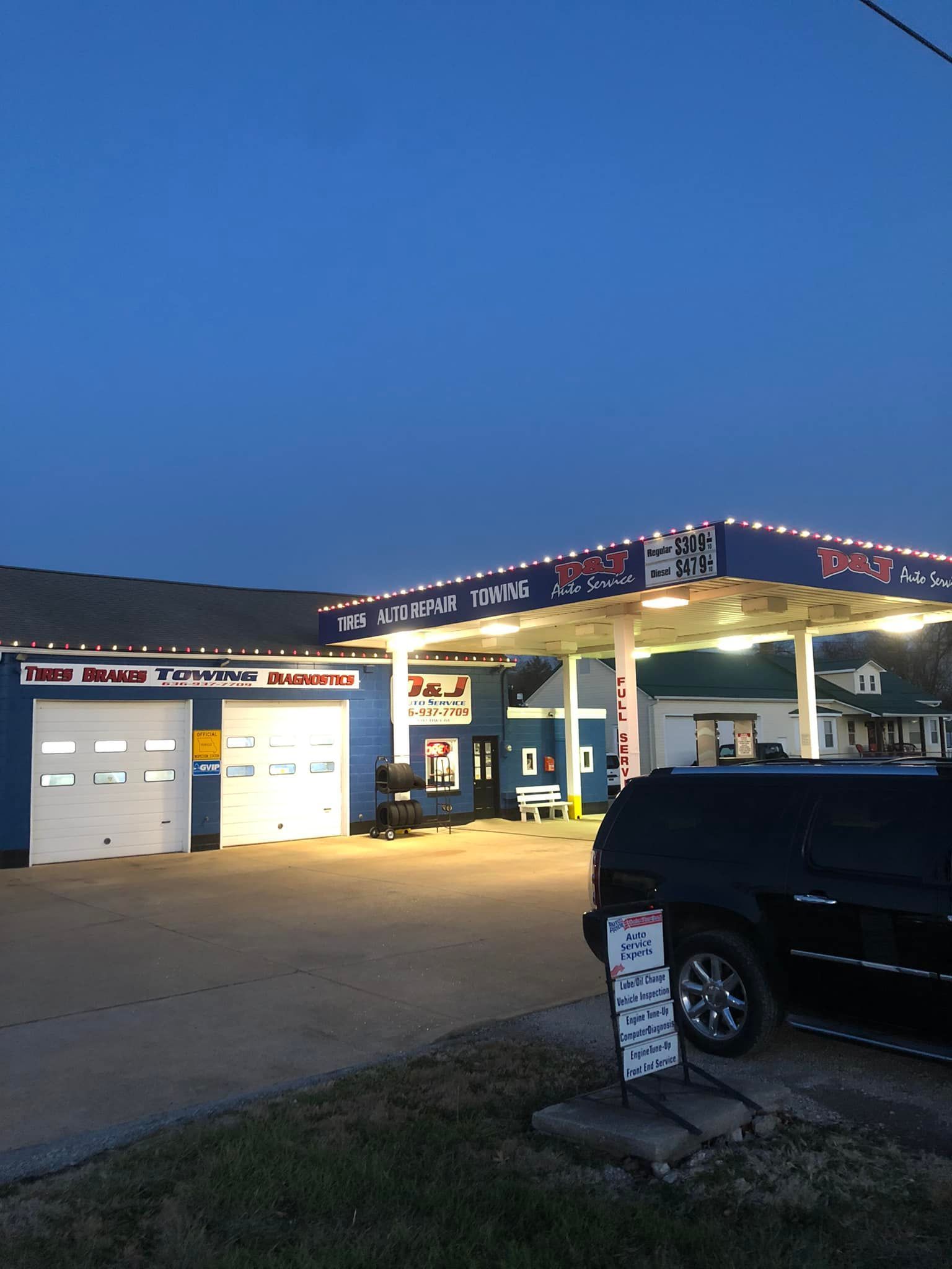 A car is parked in front of a pepsi gas station