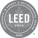 LEED Gold 2020 certification seal: a gray circular badge with text and leaf design.