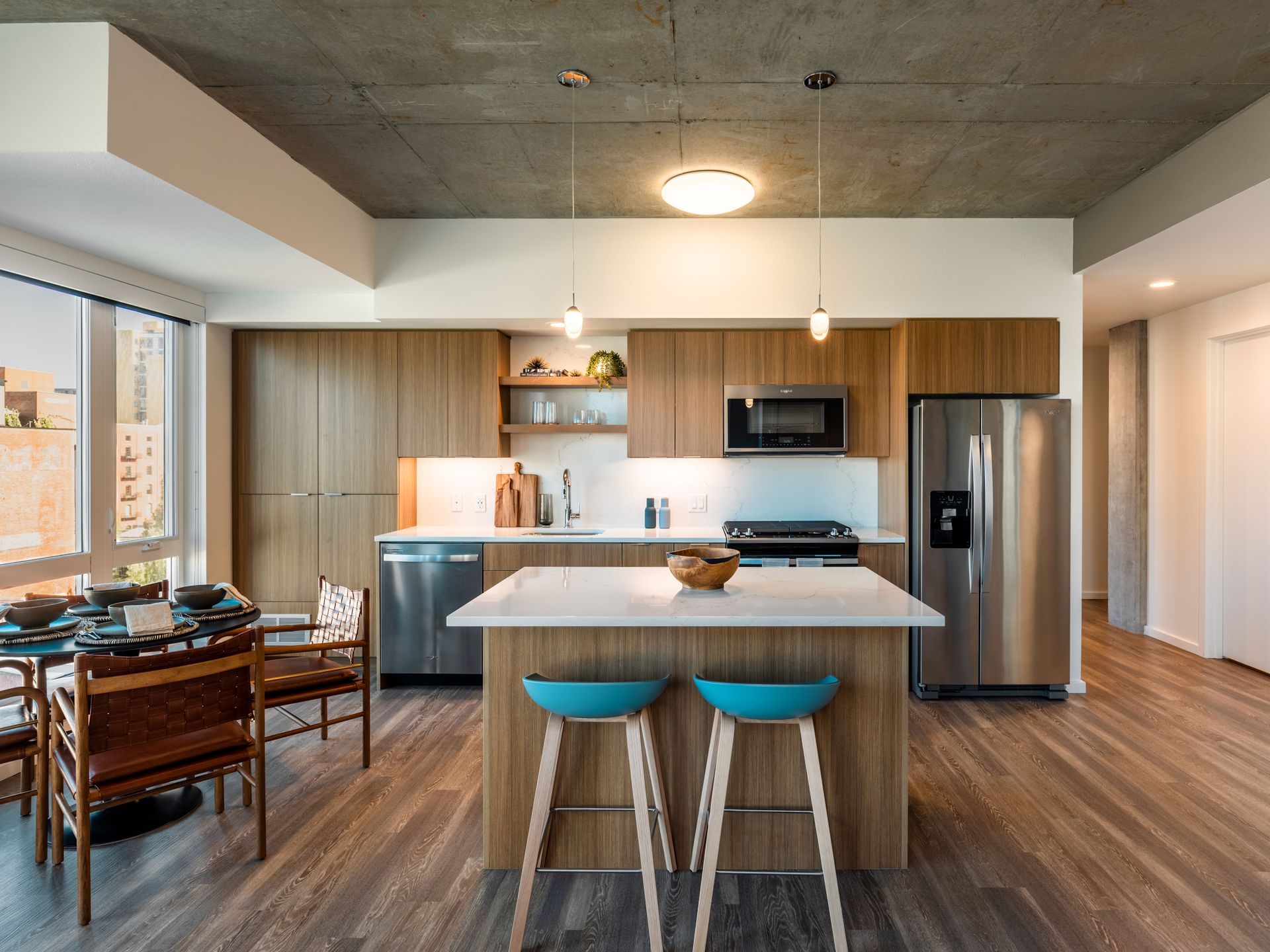 A kitchen with stainless steel appliances and wooden cabinets