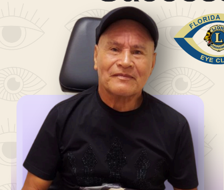 Man in black shirt and cap seated, with 