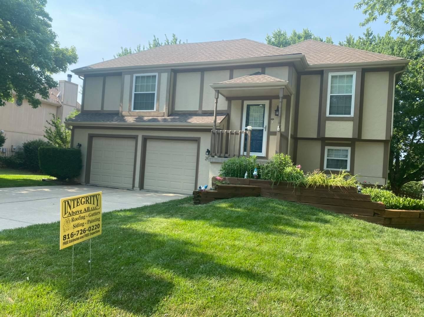 A large house with a sign in front of it