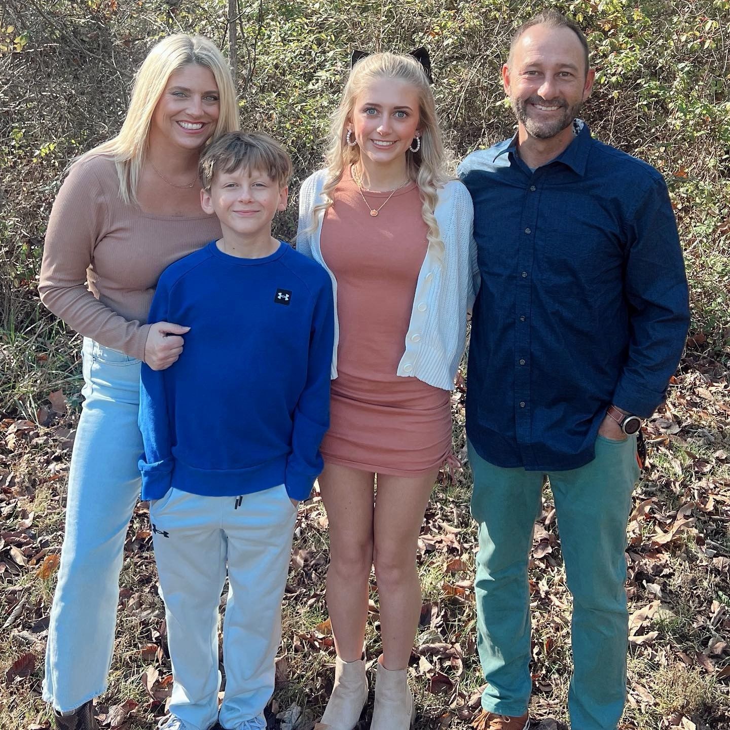 A white van is parked in front of a house that is being remodeled