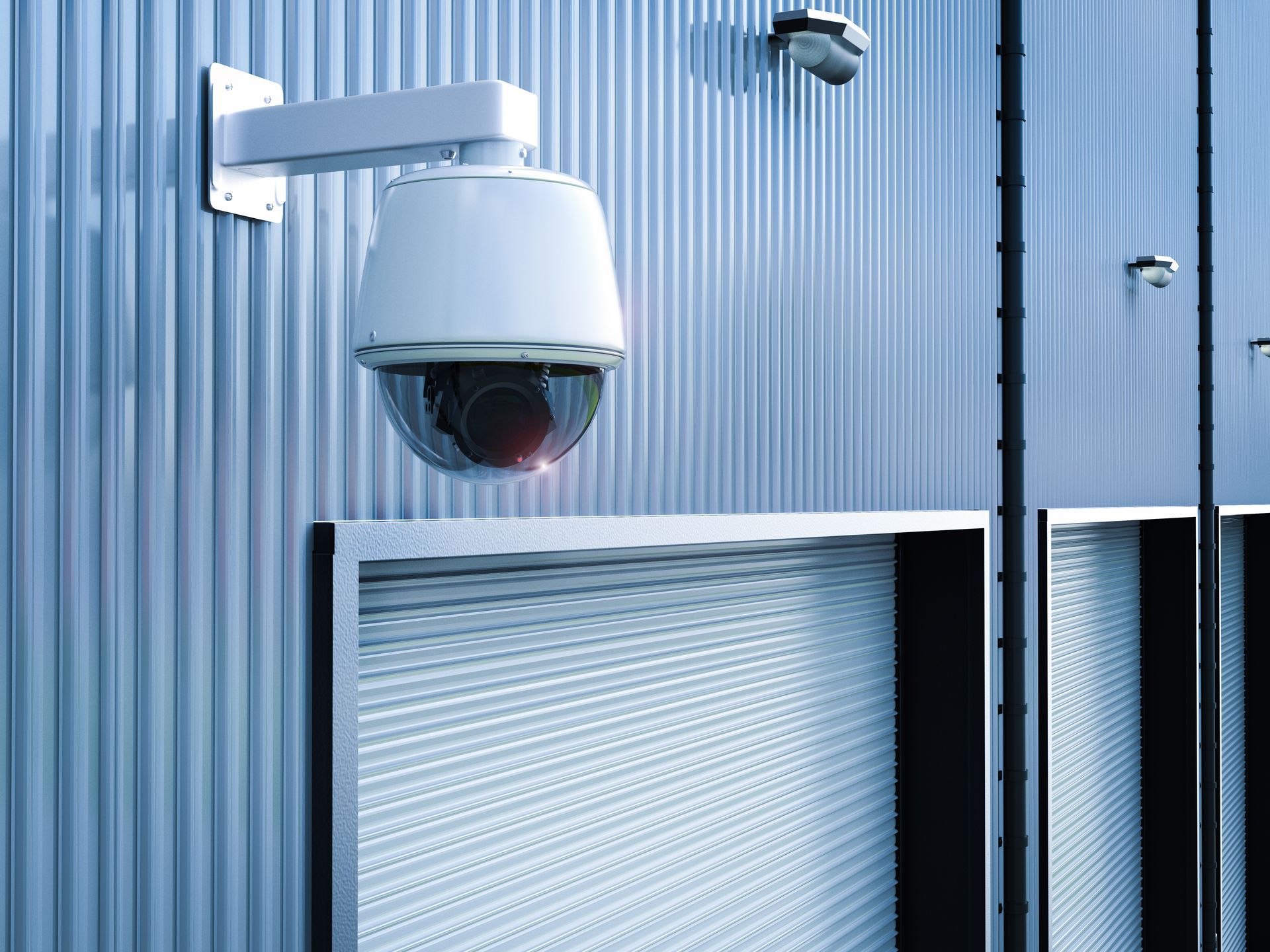 A security camera is mounted on the side of a building.