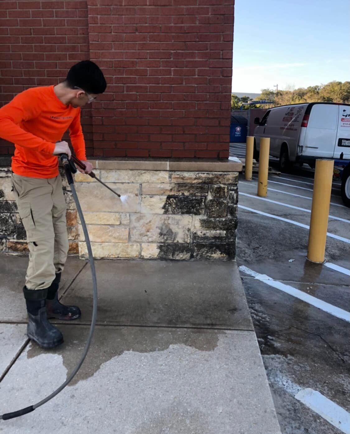 A sidewalk with cars parked on the side of it.