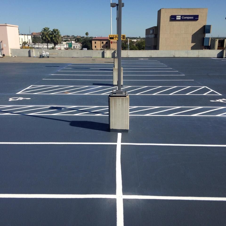 A parking lot with a building in the background that says fortune