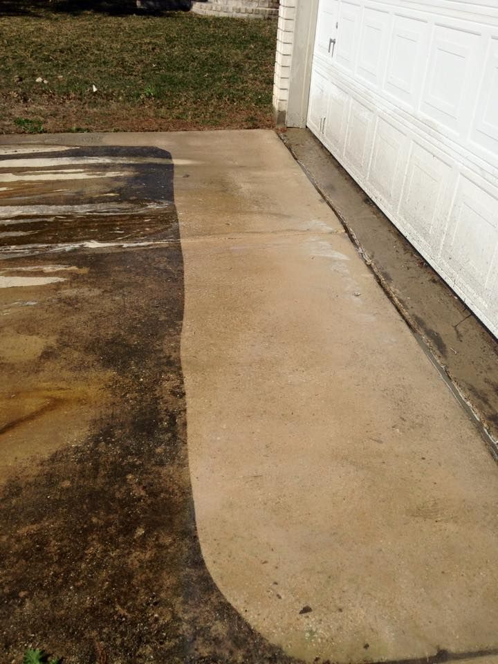 A before and after picture of a concrete driveway next to a garage door.