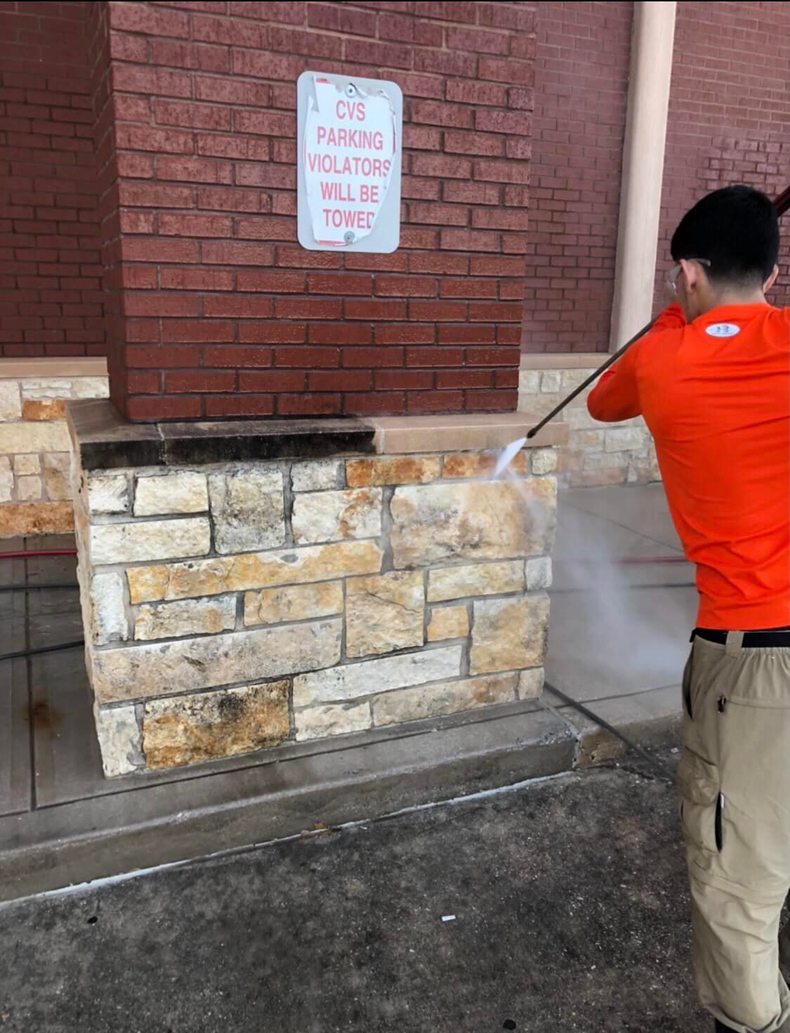 A sidewalk with cars parked on the side of it.