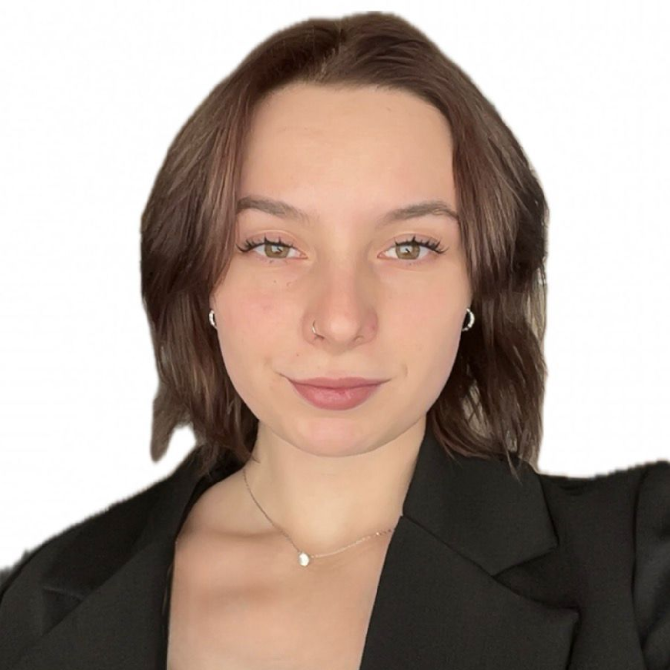 Woman with brown hair, smiling, looking towards the camera.