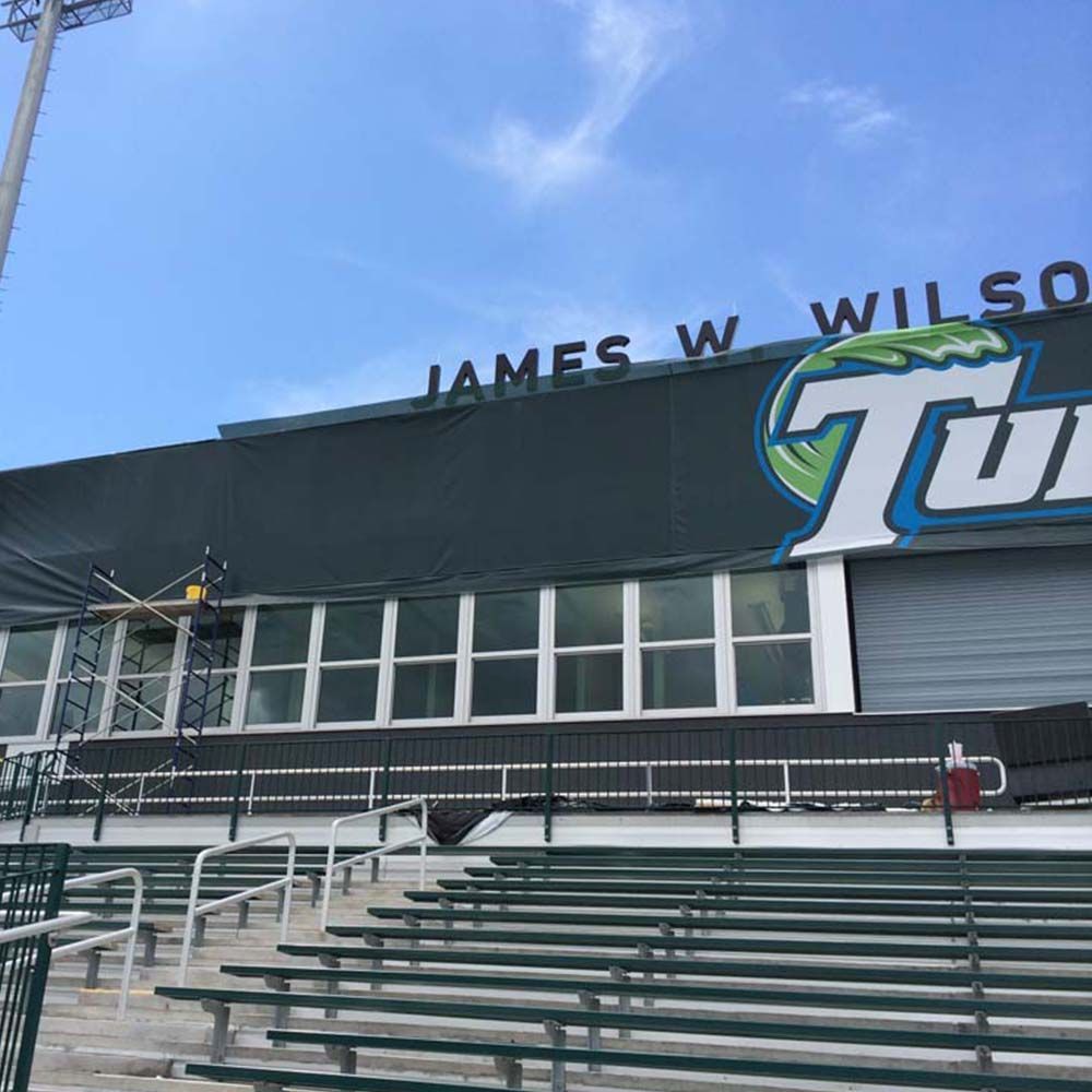 Bleachers and the James W. Wilson Turf Stadium facade with a 