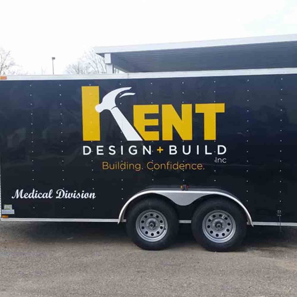 Black trailer with yellow and white