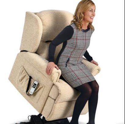 Woman getting up of a rise and recline chair