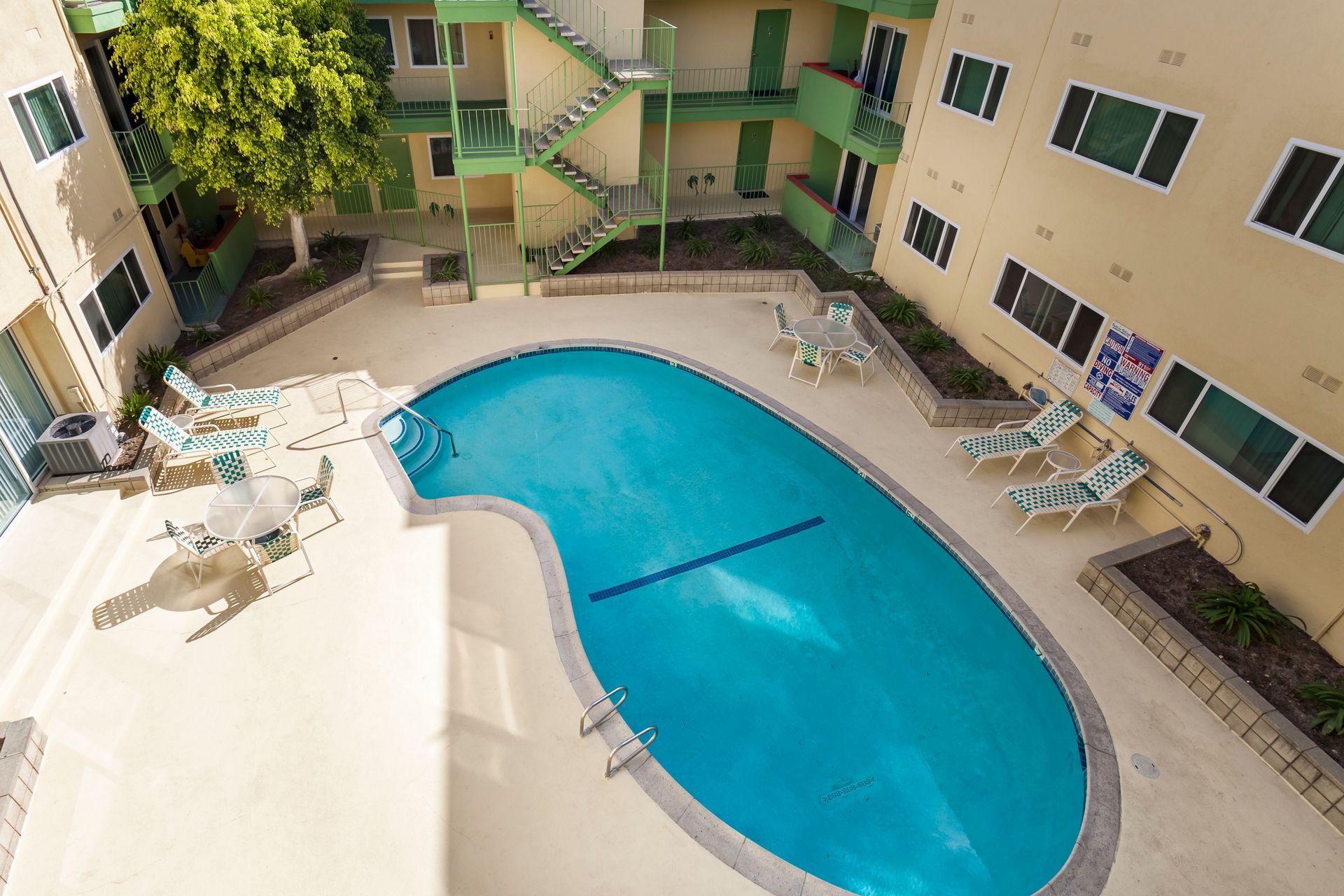 An aerial view of a large swimming pool in the middle of a building