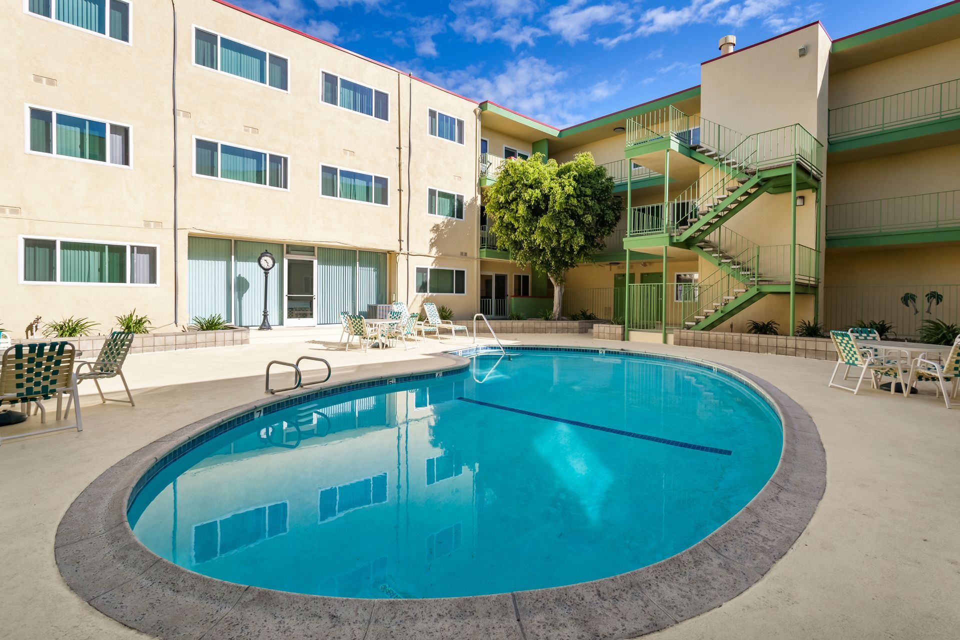 A large swimming pool in front of a building