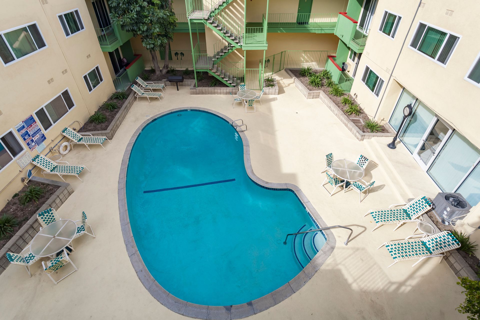 An aerial view of a swimming pool in the middle of a building