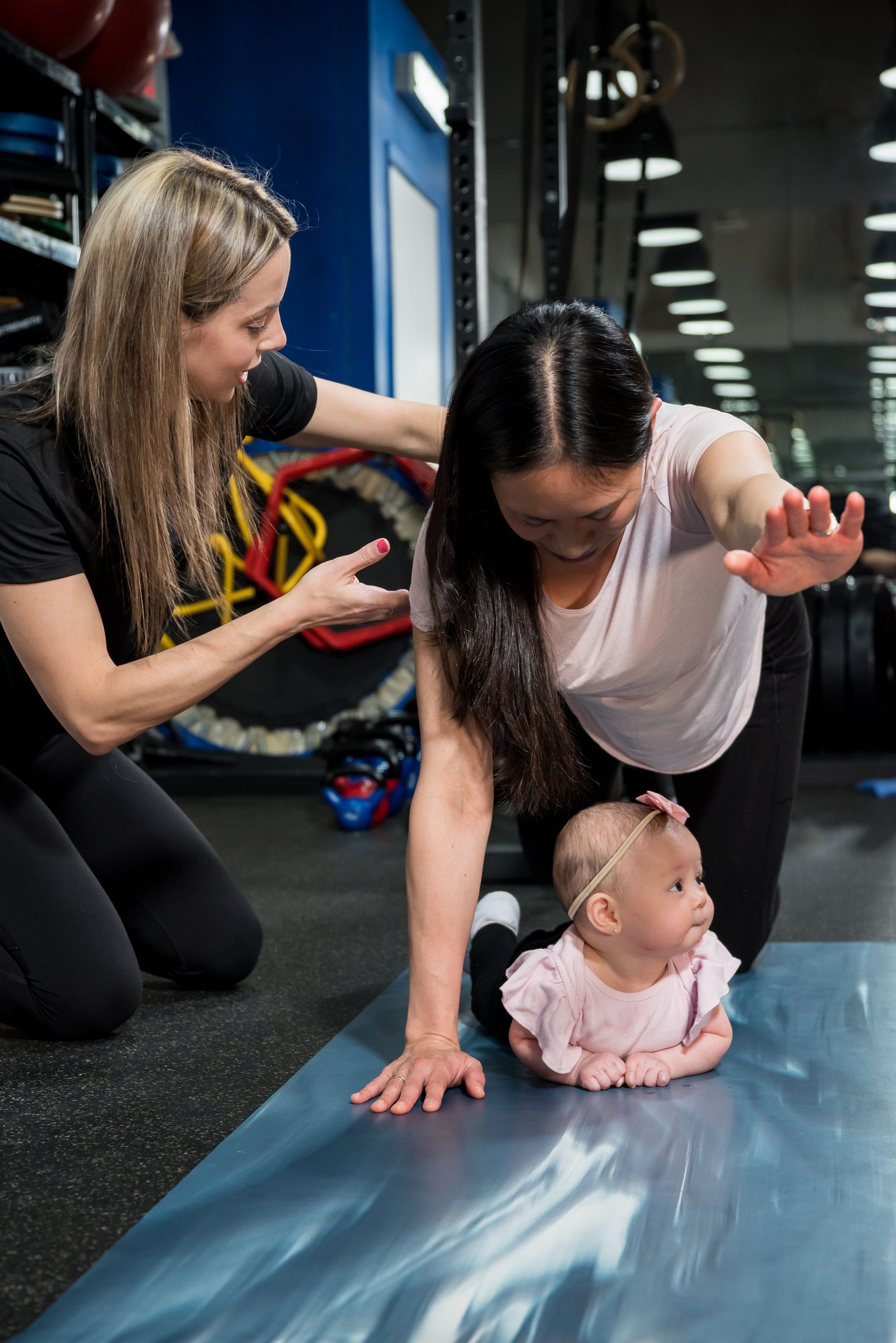 pregnant woman training on a medicine ball