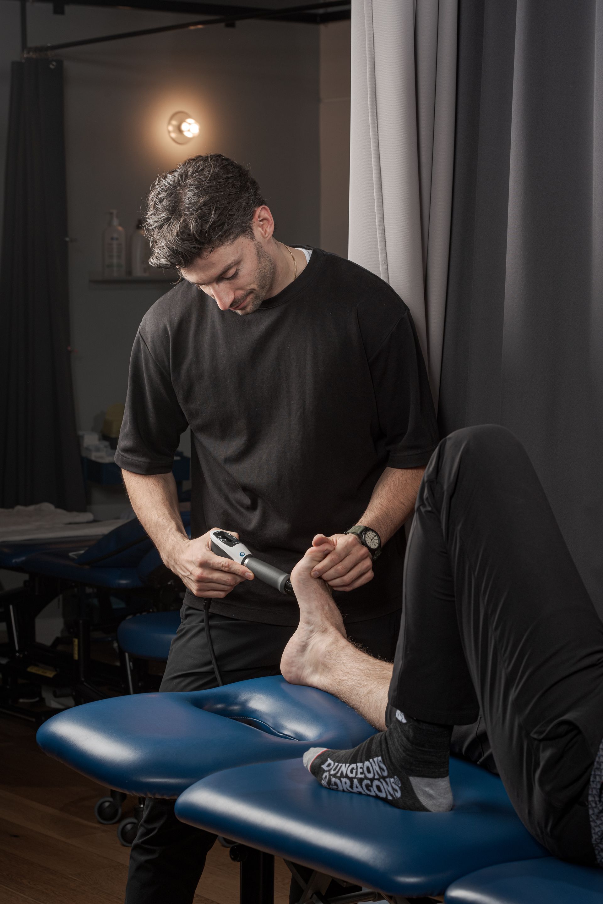 a person is getting a treatment on their knee