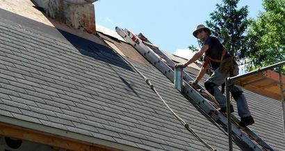 Man repairing roof and siding - Sir Fix It in Hampton, VA