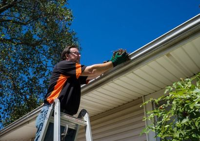 Man cleaning the gutter - Sir Fix It in Hampton, VA