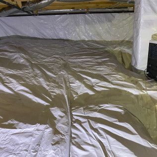 Crawl space with white vapor barrier on the floor and walls. A/C unit is visible in the corner.