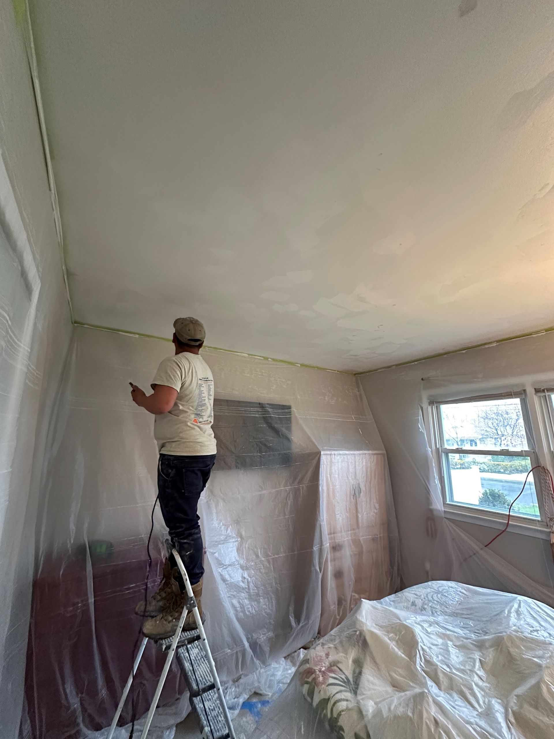 Man Painting A Ceiling — Monmouth and Ocean Counties — Total Home Renovation