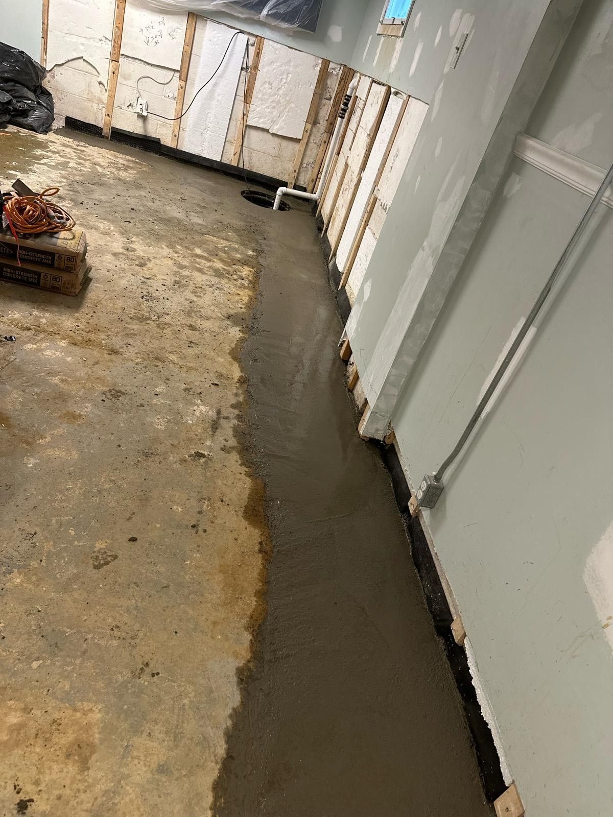 Concrete Floor Being Poured — Monmouth and Ocean Counties — Total Home Renovation