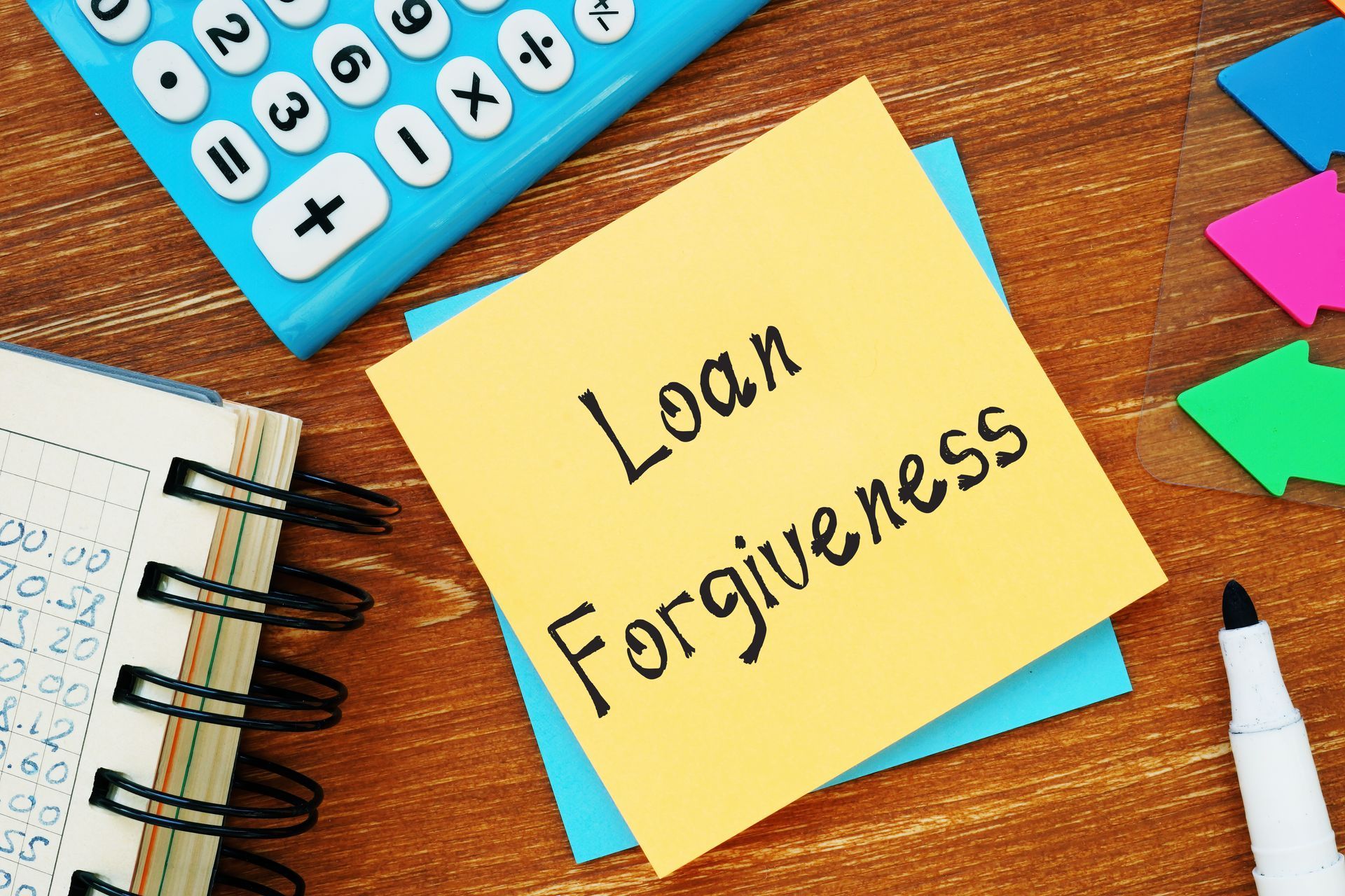 a sticky note with the words loan forgiveness written on it