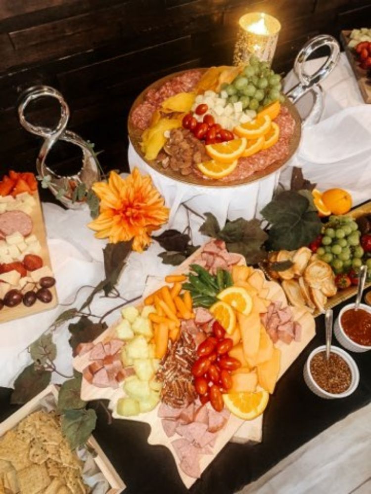 A table topped with a variety of food and a candle.