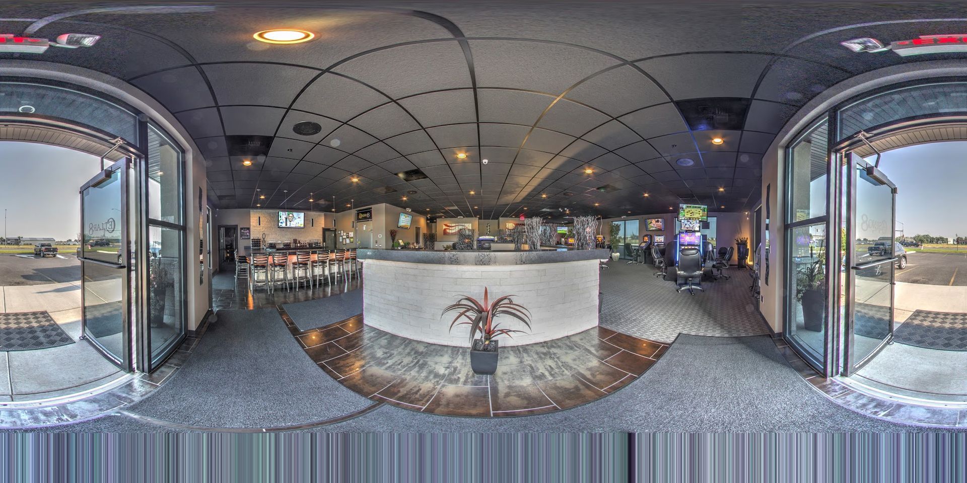 A 360 degree view of a restaurant with a bar and tables.