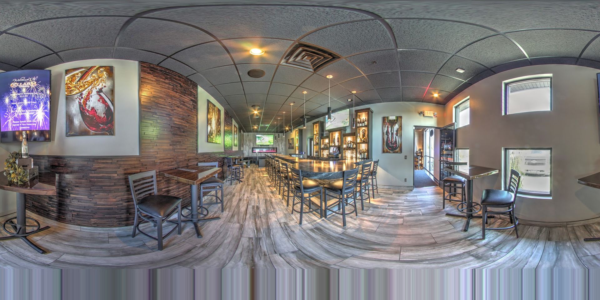 A 360 degree view of a restaurant with tables and chairs.