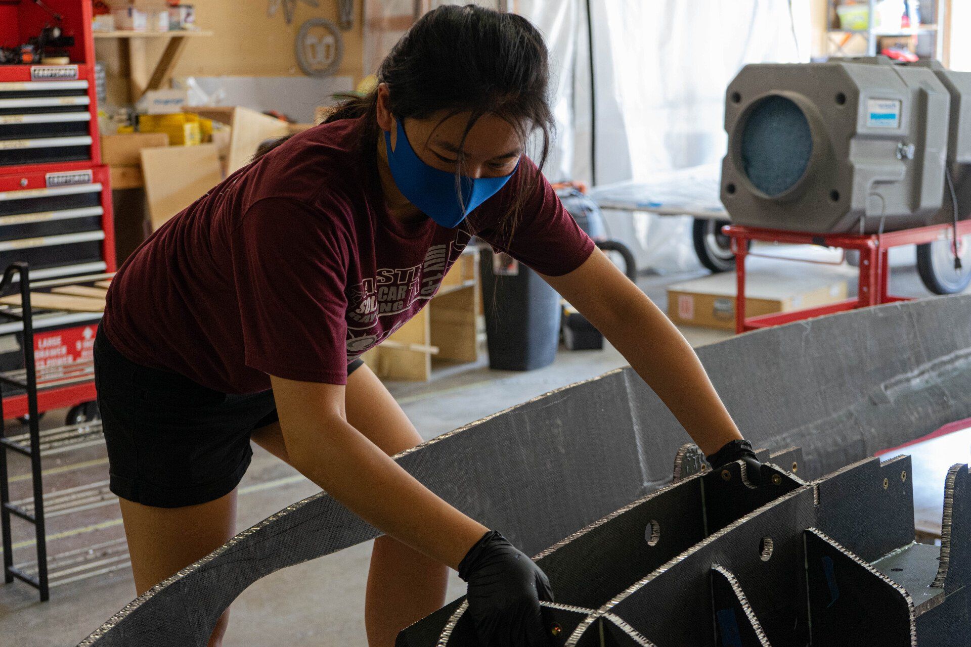Lucy tests the fit of the chassis inside the outer shell.