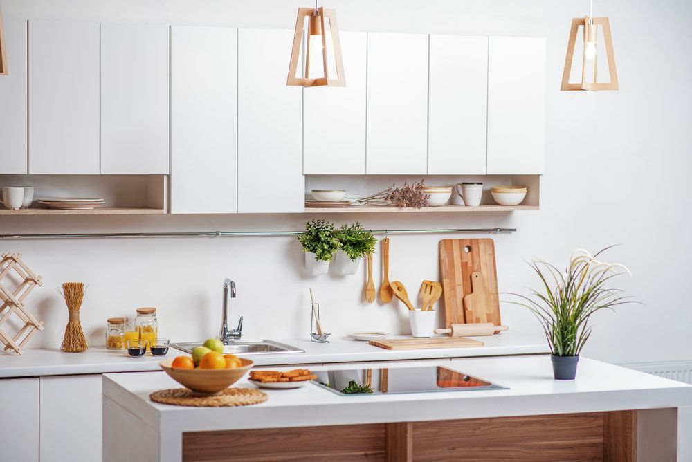 A Kitchen with White Cabinets and A Wooden Counter Top — Radburn Carpentry in Tamworth, NSW