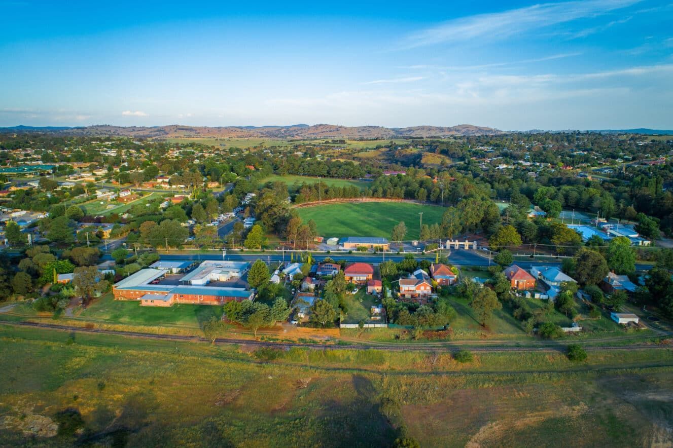An Aerial View of A Small Town Surrounded by Trees and Houses — Radburn Carpentry in Manilla, NSW
