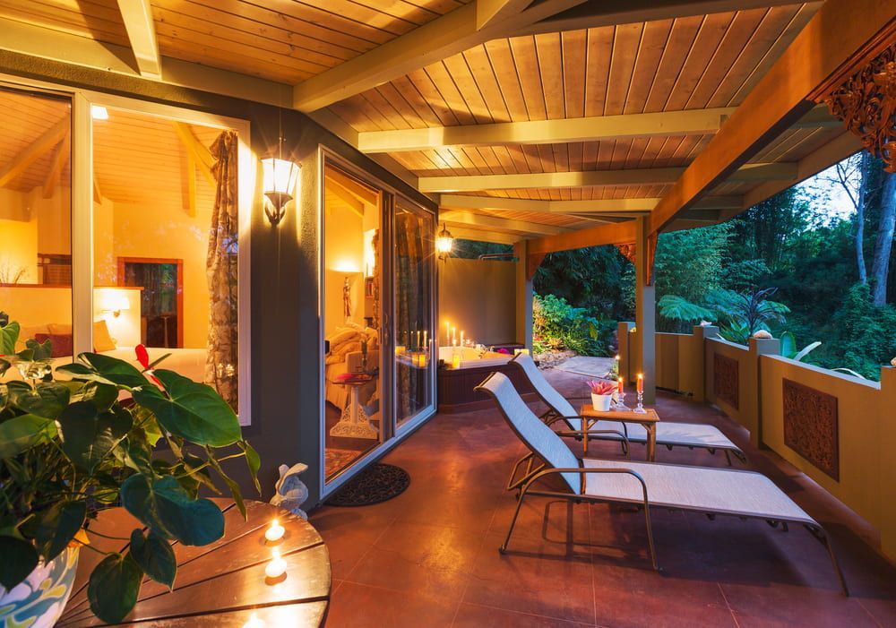 A Patio with Chairs and A Table with Candles on It — Radburn Carpentry in Tamworth, NSW