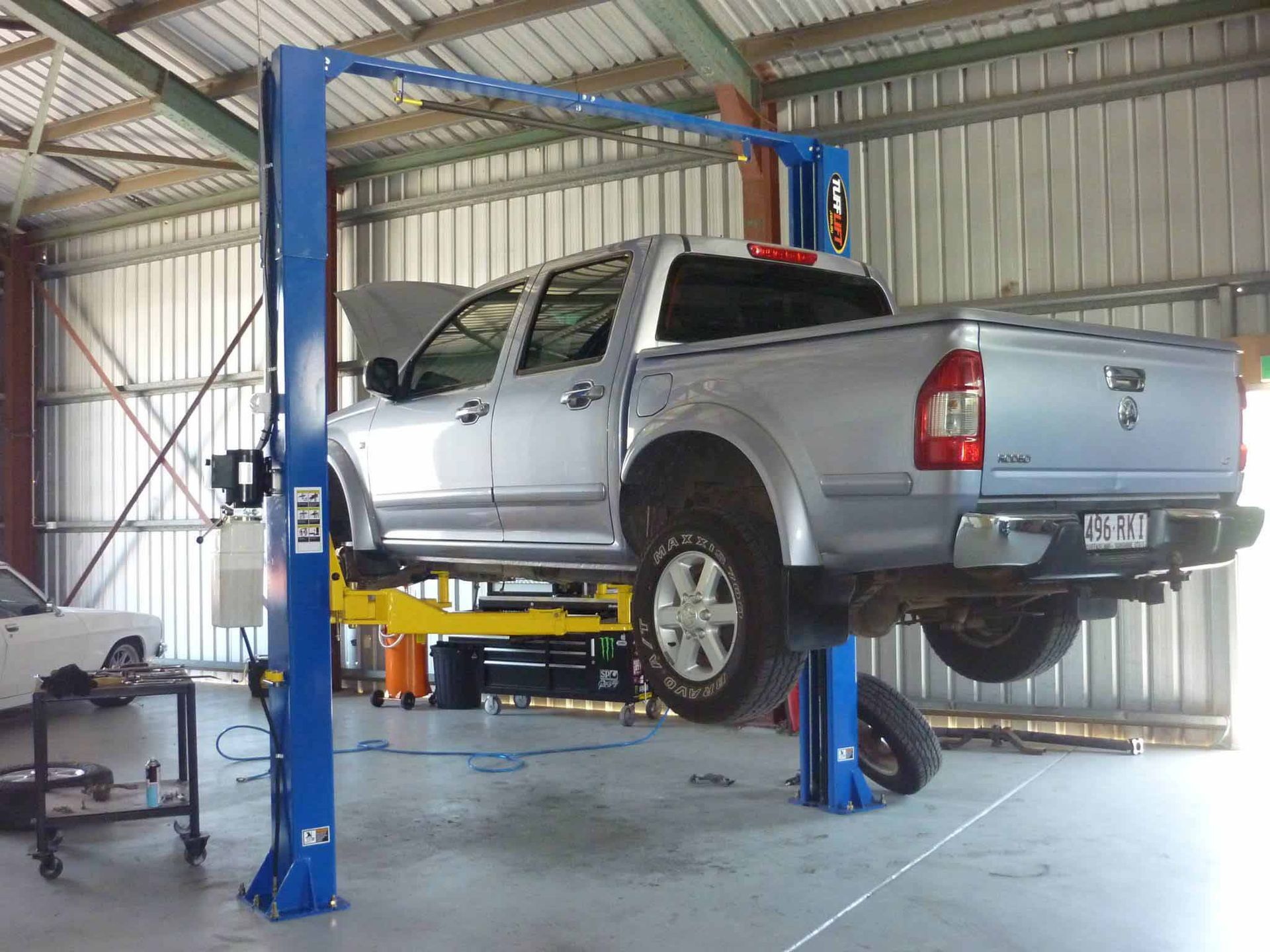 A Grey Pick-up Truck Inside the Garage — Mechanical Repairs in Bundaberg, QLD